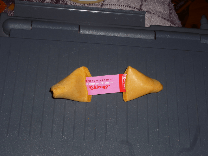back of same fortune cookie, says visit ice cream museum of chicago.
