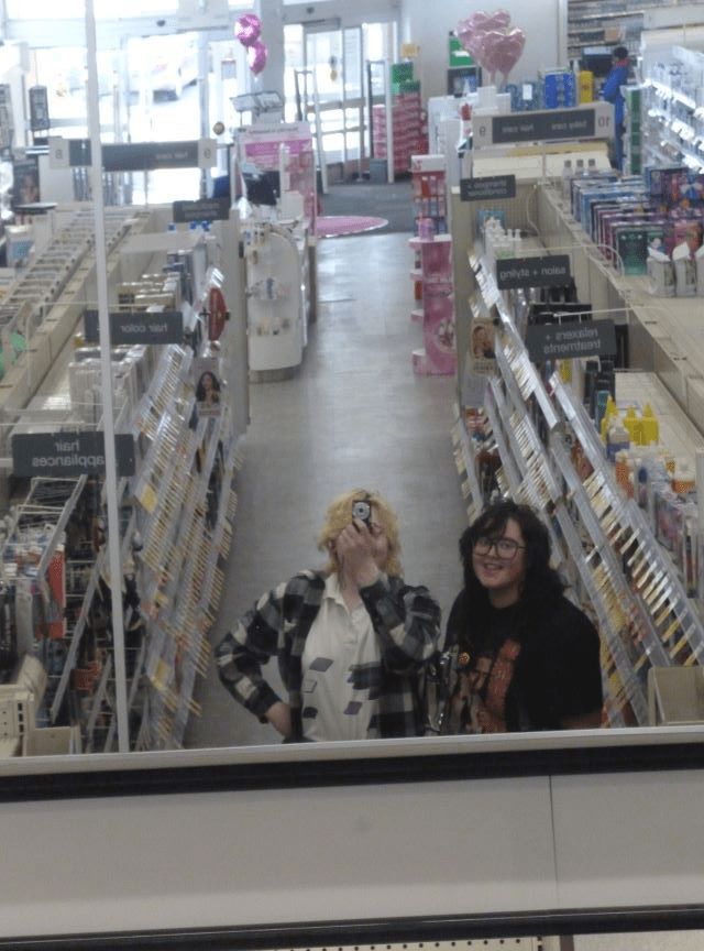 Lucia and I in our local Walgreens mirror photo with the big mirror